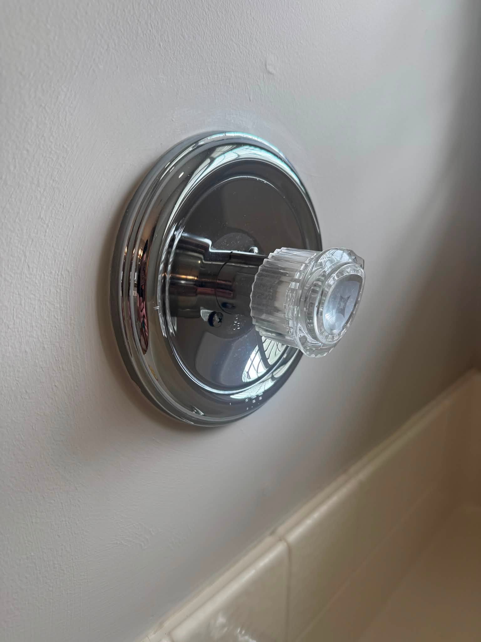 Polished shower fixture after a detailed deep clean